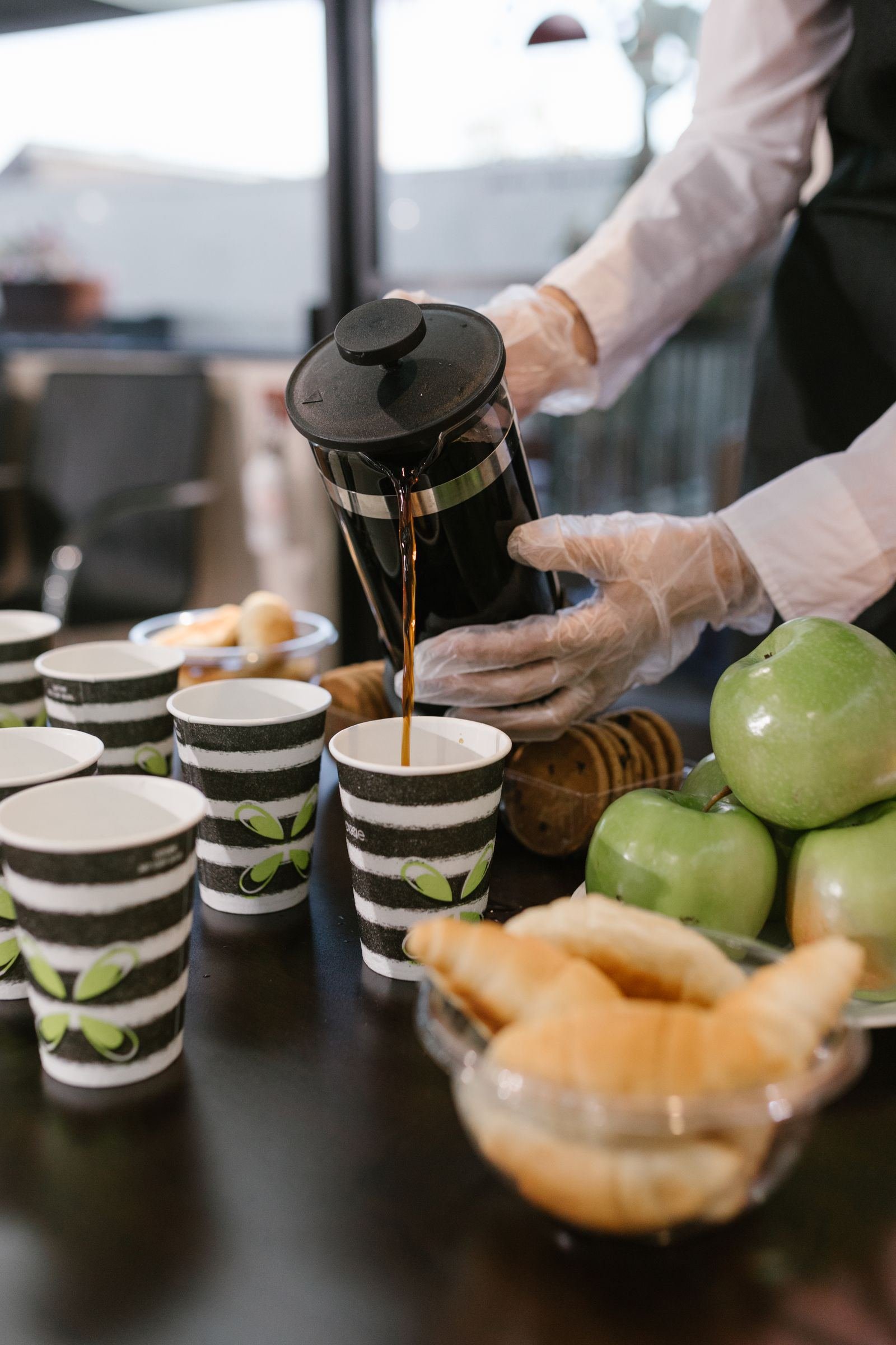 Barista pouring coffee for guests at a corporate event